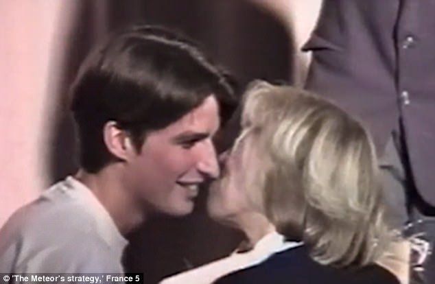 Footage captures the moment a 15-year-old Emmanuel Macron (left) kissed his 40-year-old teacher (right) - two years before he declared he wanted to marry her eiqrqidzziquuglv